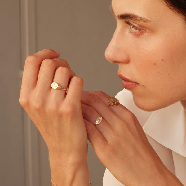 Mini Greek d-eye ring gold and white diamonds